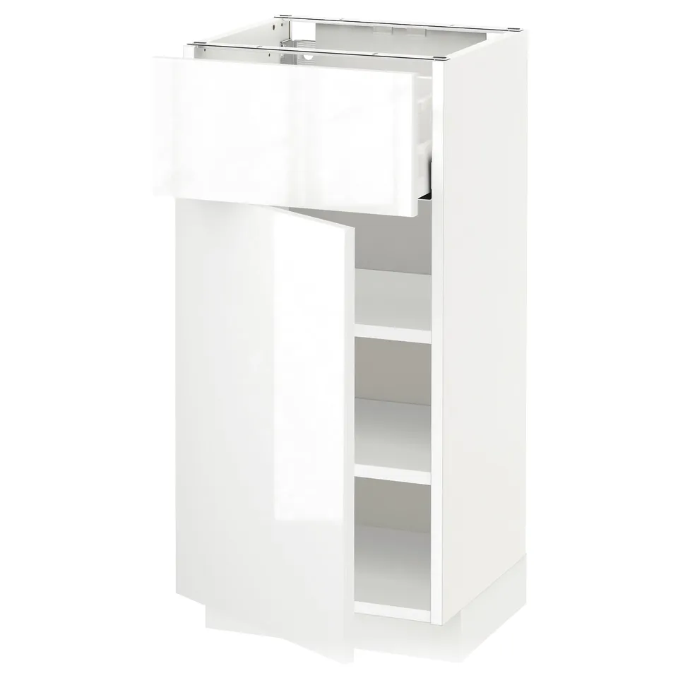 White high-gloss kitchen cabinet with one open drawer.