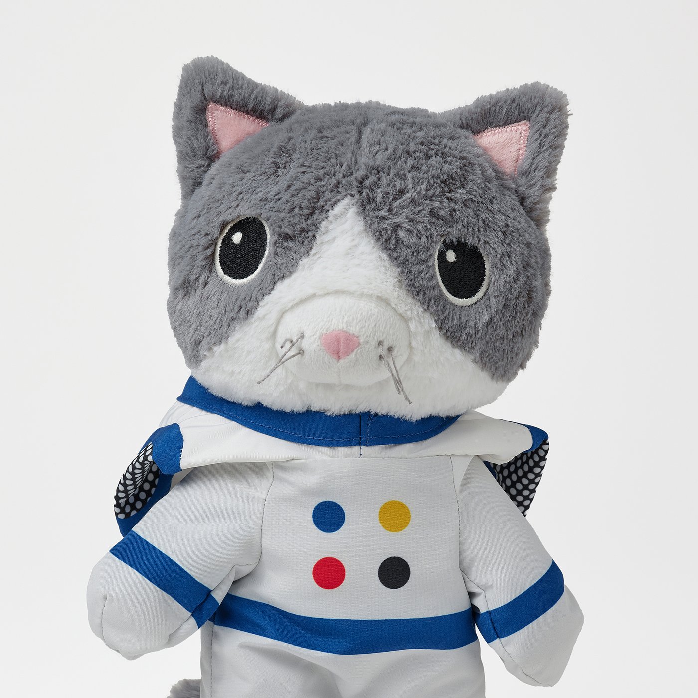 Stuffed cat in astronaut outfit, soft, high quality, safe materials.