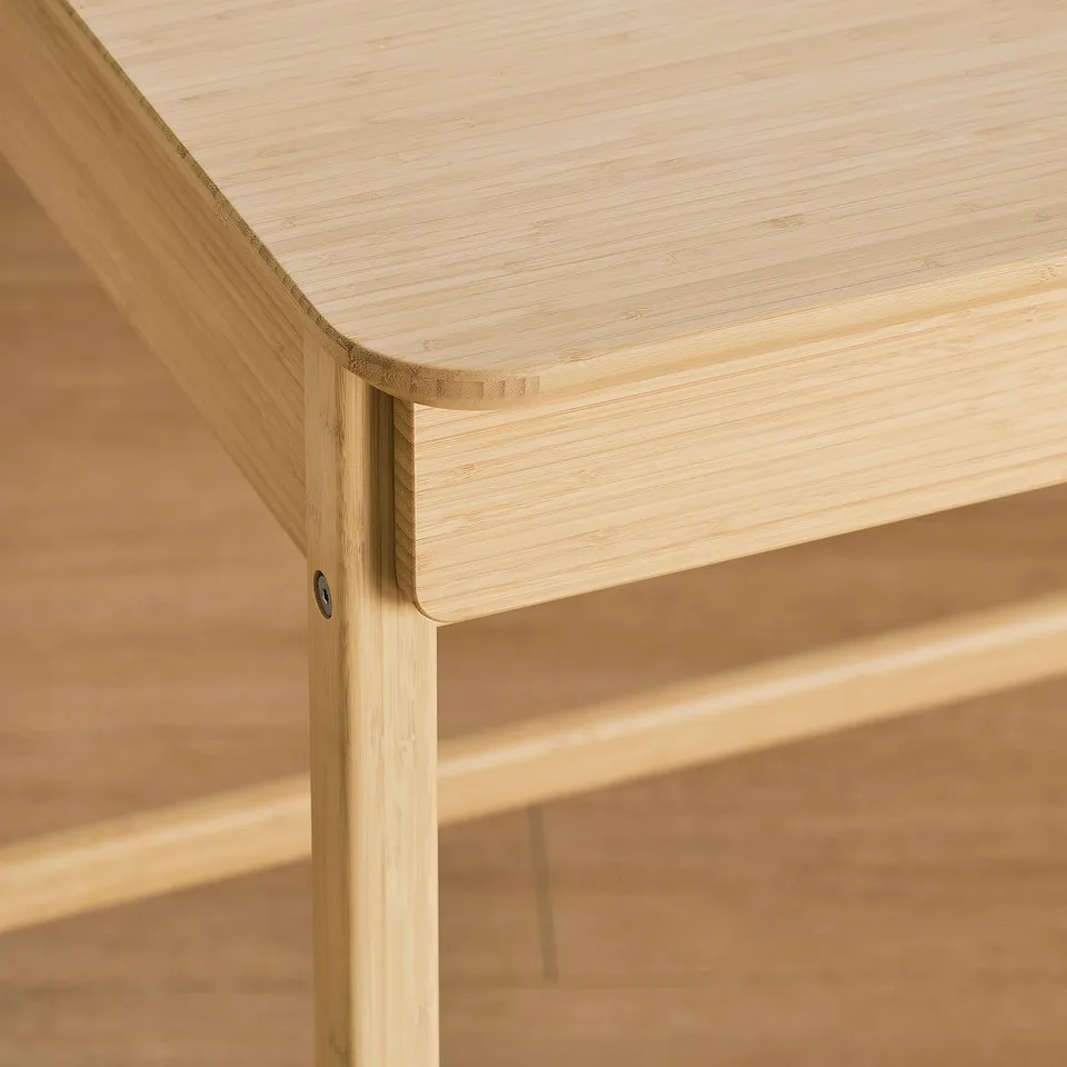 Sleek bamboo desk corner, smooth finish & sturdy design, natural wood appeal.