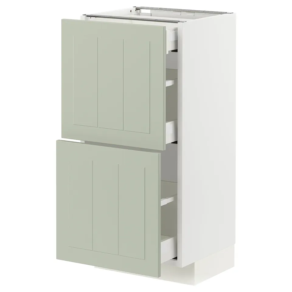 A light green METOD kitchen cabinet with two drawers and two doors, featuring a sleek and modern design.