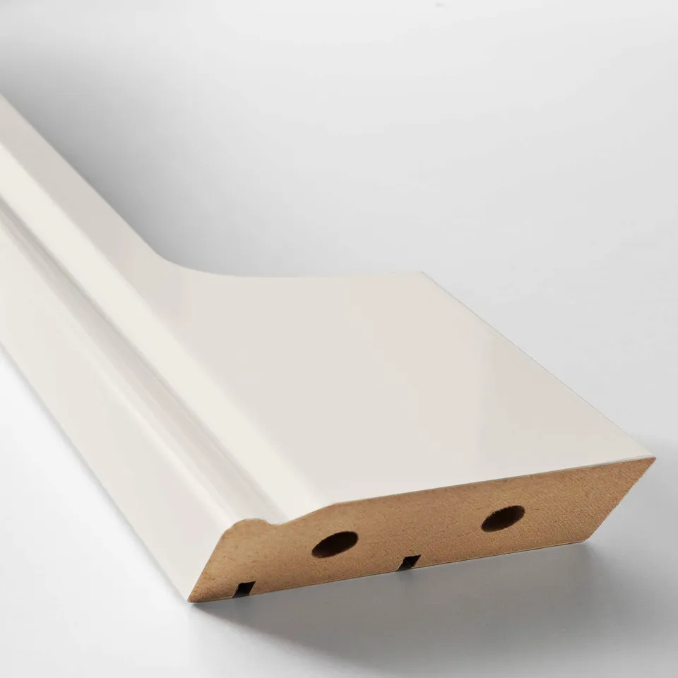 White plastic and fiberboard kitchen plinth with cutouts, sleek and modern design.
