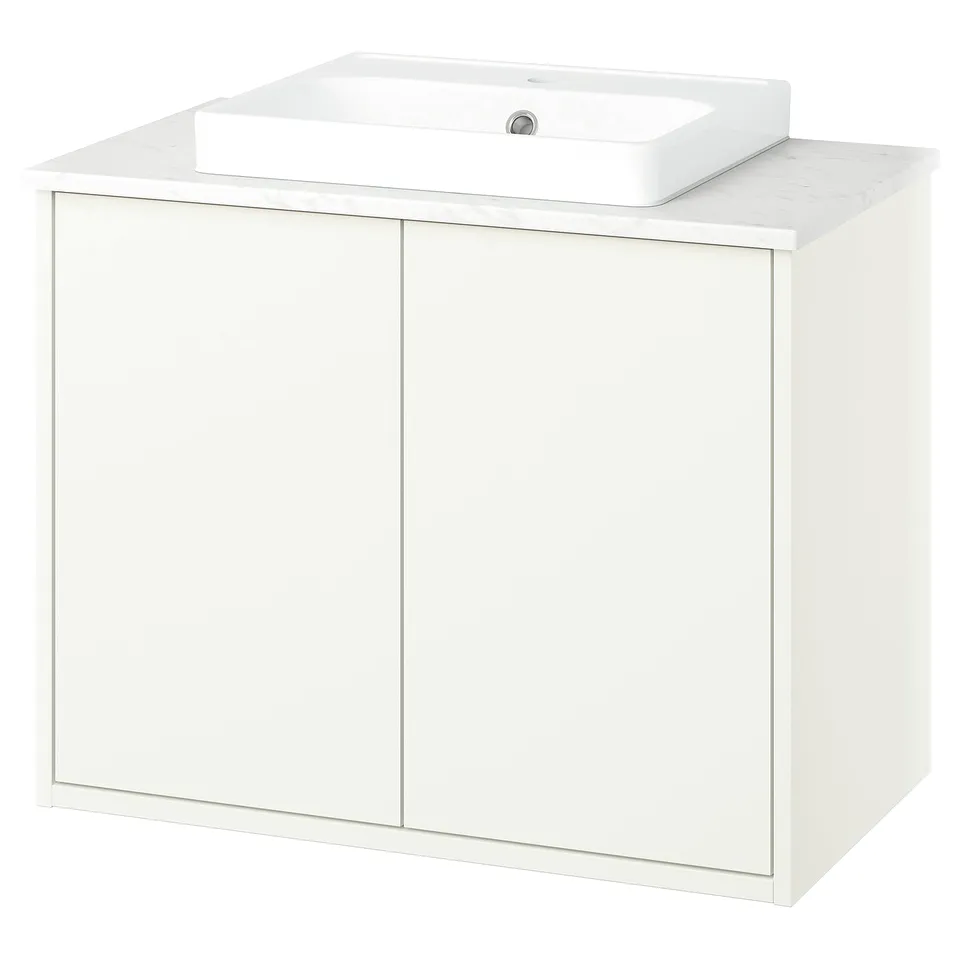 White bathroom vanity, modern design with marble countertop and rectangular basin.