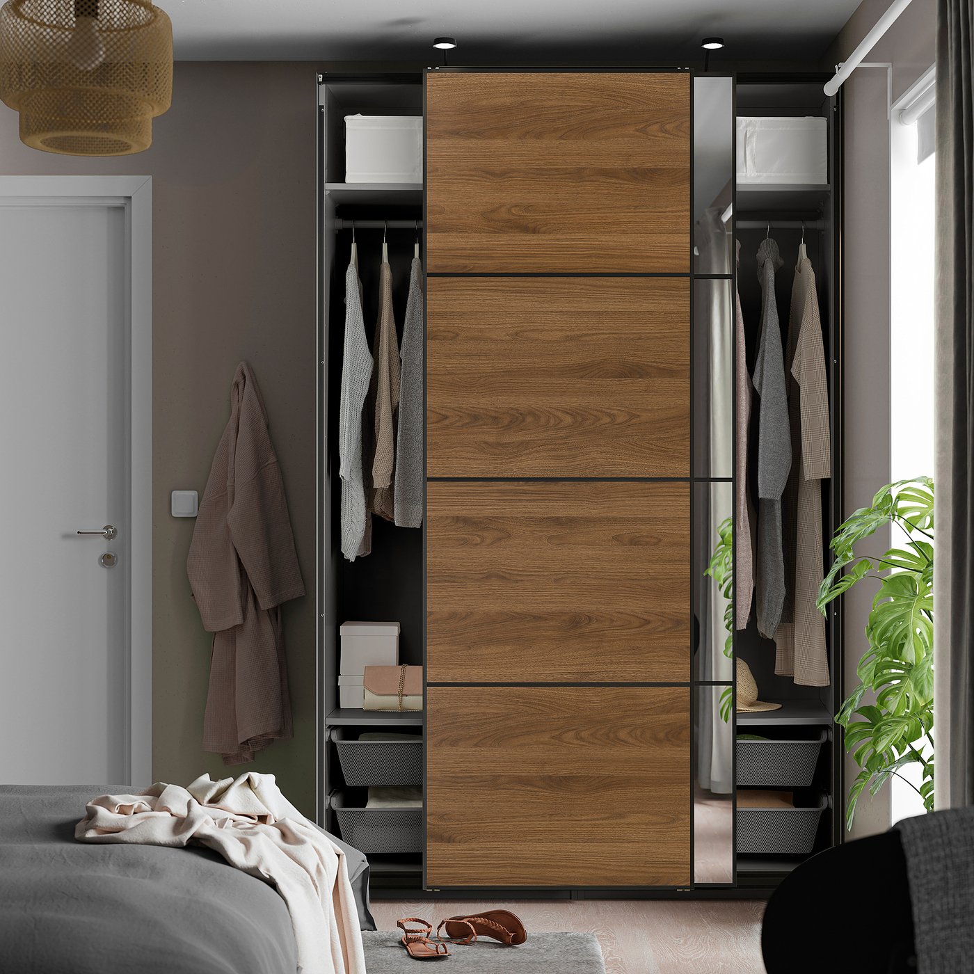 Modern bedroom with PAX wardrobe, sliding doors & hanging clothes.