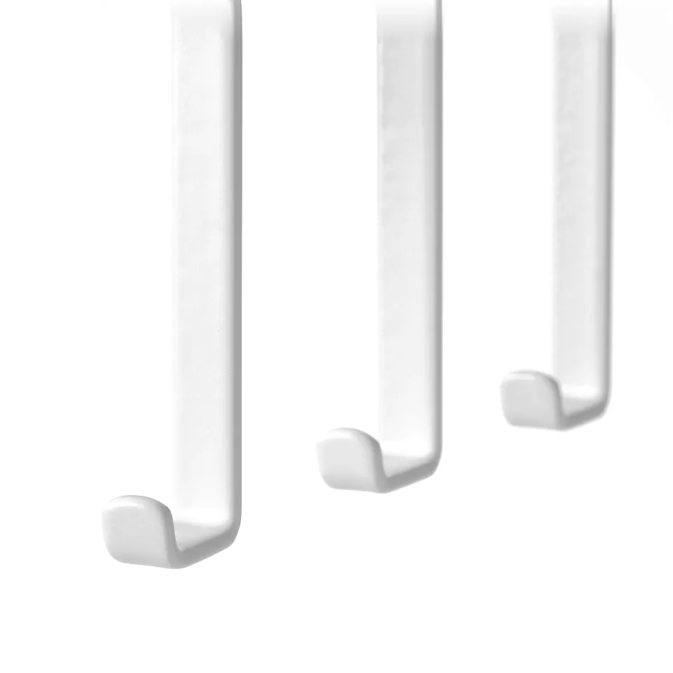Three white hooks mounted in a row. Easy to instal, ideal for kitchen storage.