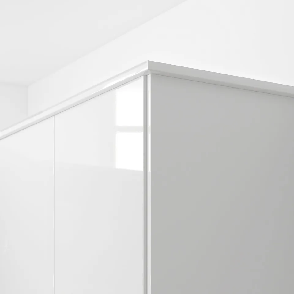 White glossy edge trim for kitchen cabinets, hiding lighting and cords, with a 25-year guarantee.