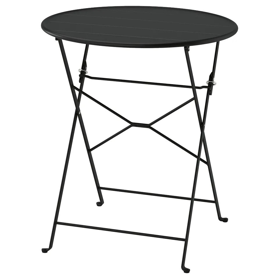Black foldable metal table with round top, sleek design, perfect for small spaces.