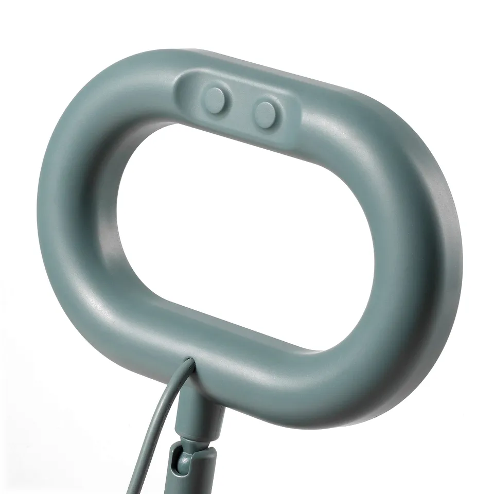Compact, sleek ring lamp with soft handle, attached by neatly organised cable, offering versatile lighting control.