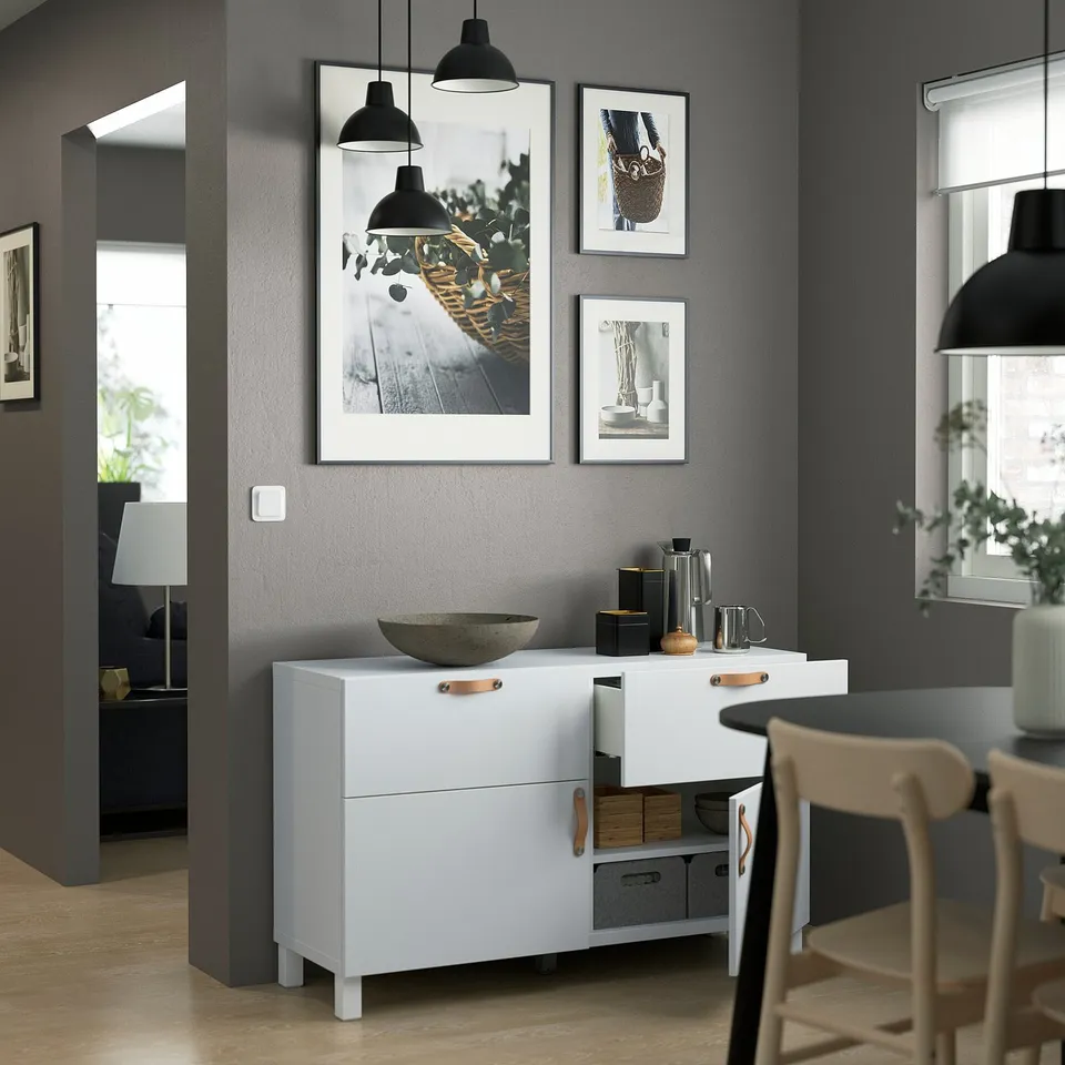 Modern room with BESTÅ sideboard showcasing photos and decor.