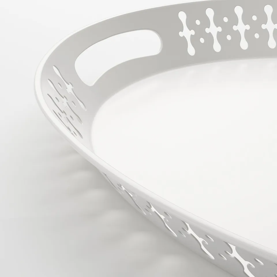 Close-up of ROMANTISK trays sturdy, textured handles. Smooth, curved edges, designed for easy carrying.