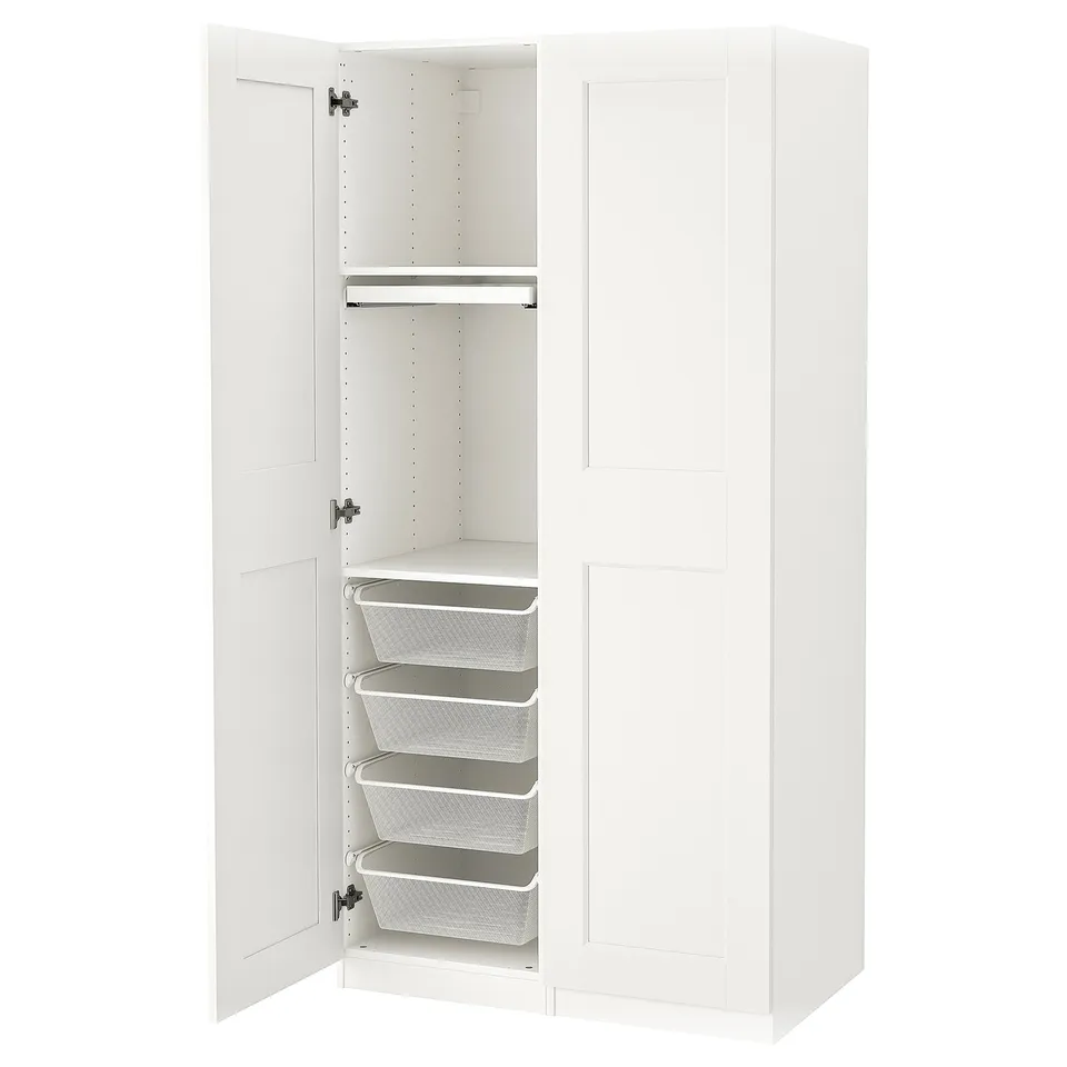 White PAX wardrobe, open revealing mesh baskets, drawers, and trouser hanger.