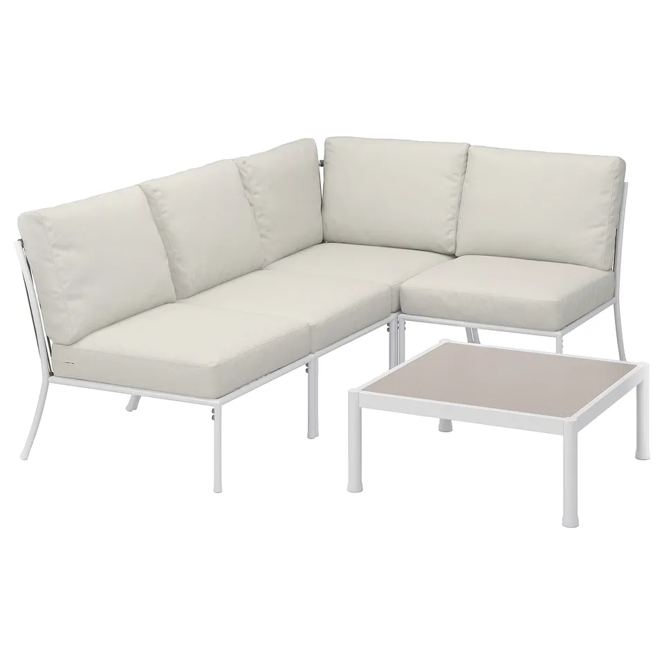 Modern white outdoor sectional, clean lines, cushioned seats & back, metal frame, includes coffee table.