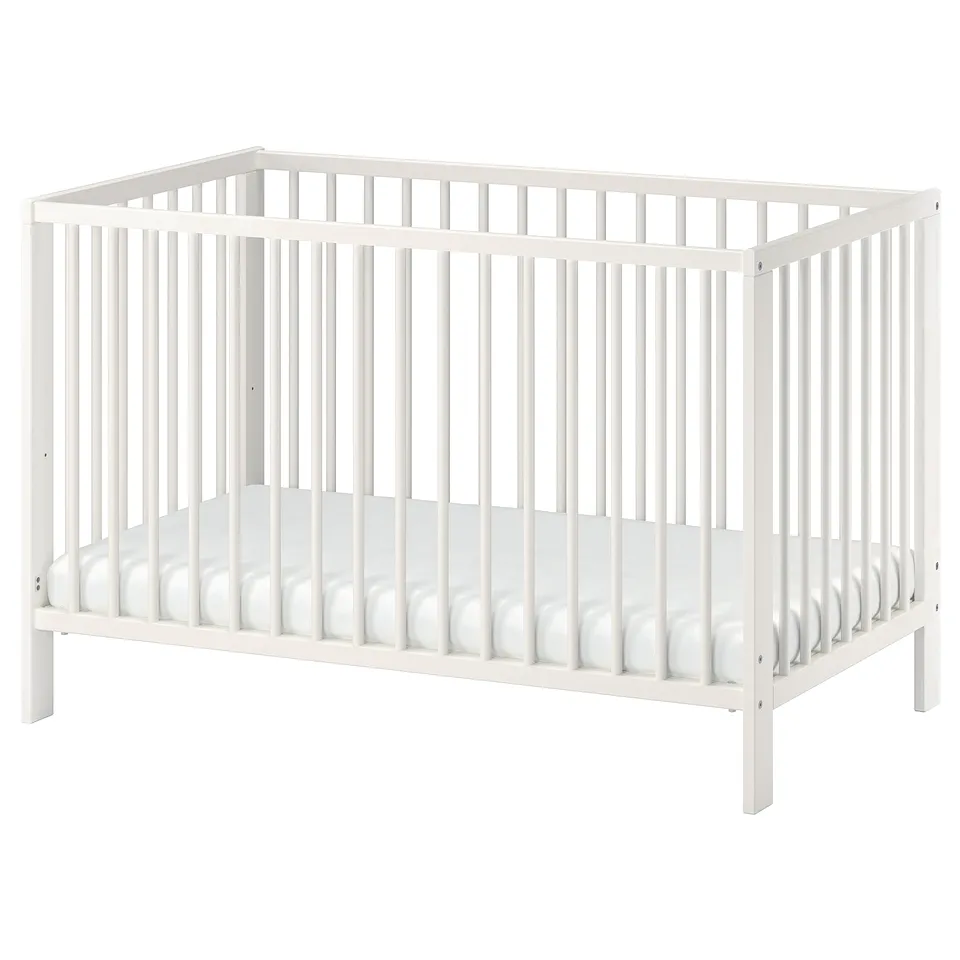 White GULLIVER baby cot with wooden frame, ventilated base, adjustable height, simple design.