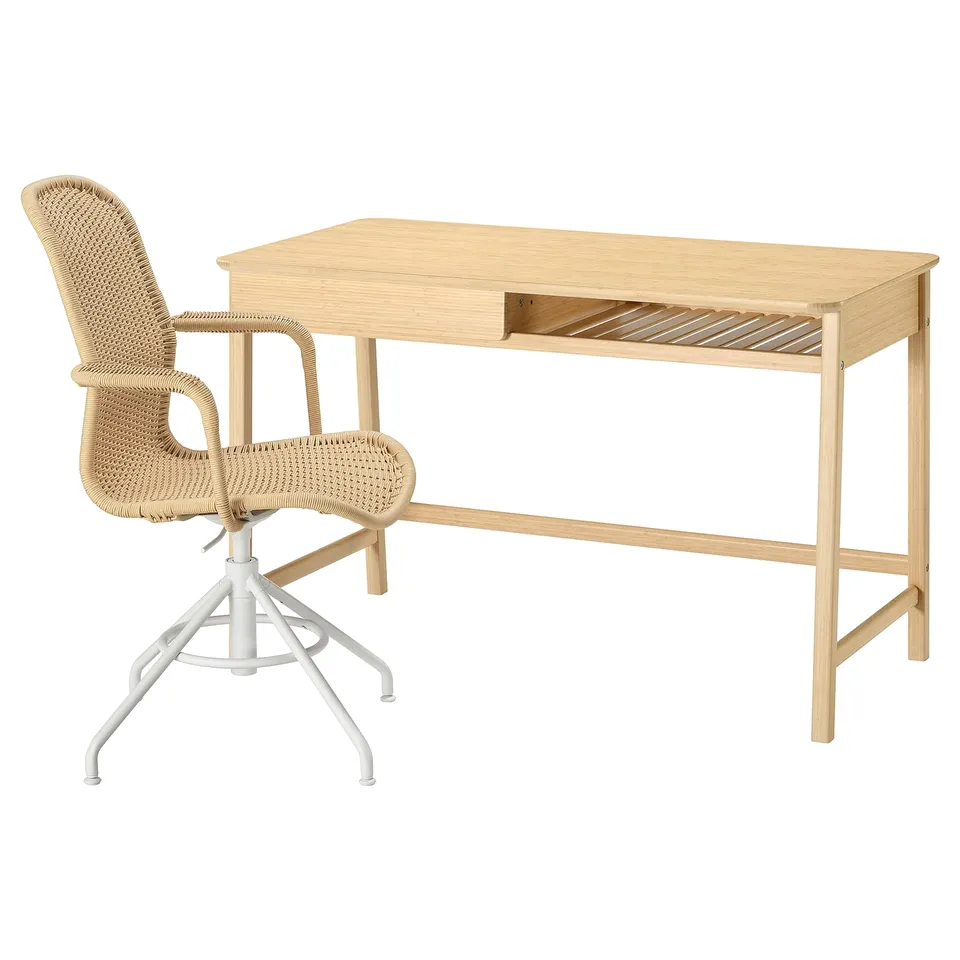Natural bamboo desk with drawer and white swivel chair with woven seat and back.