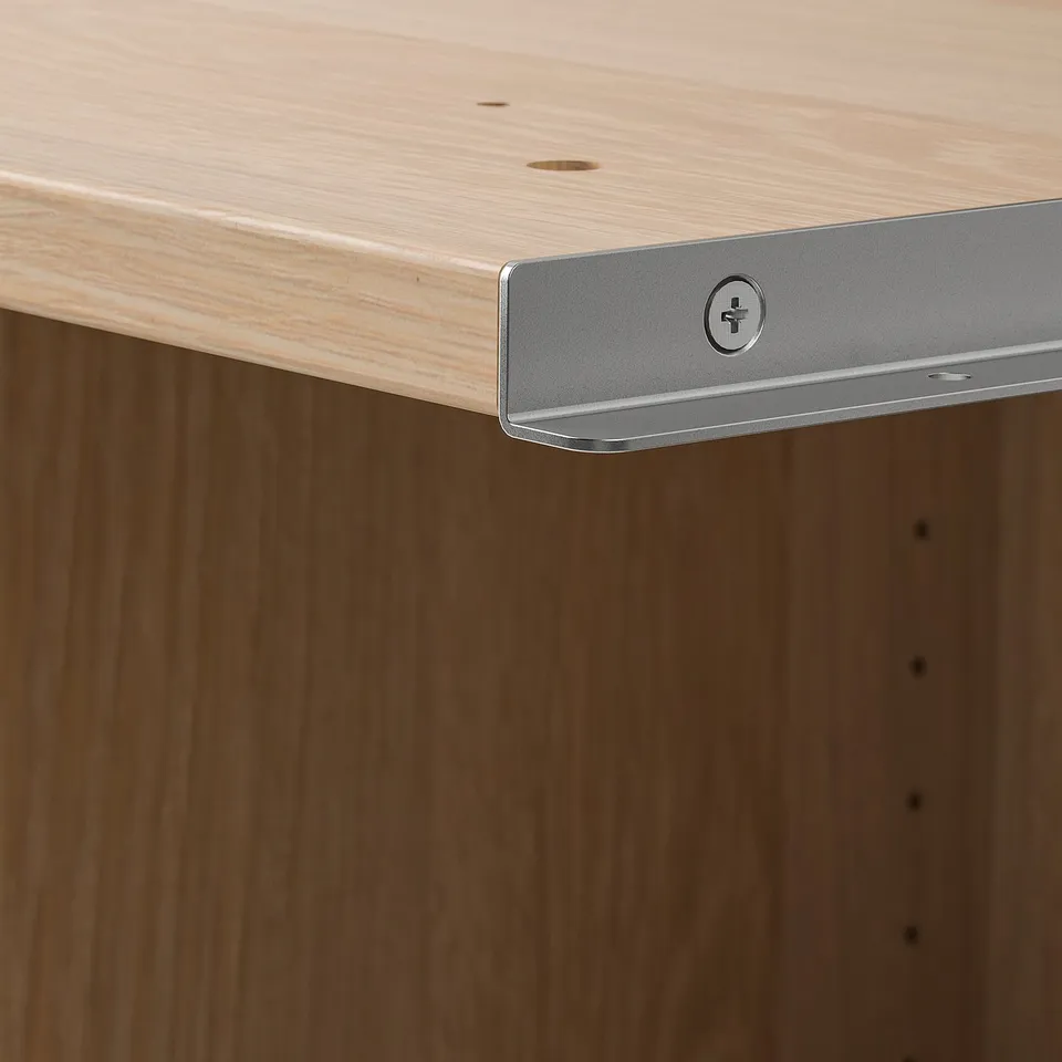Close-up of well-crafted wooden furniture with adjustable metal feet for stability.