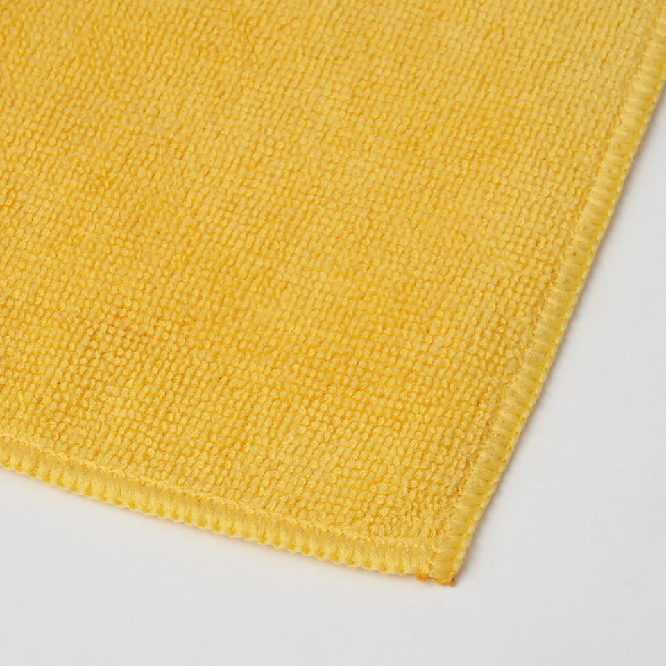 Bright yellow microfiber cloth shown, texture and stitching visible, high-quality.