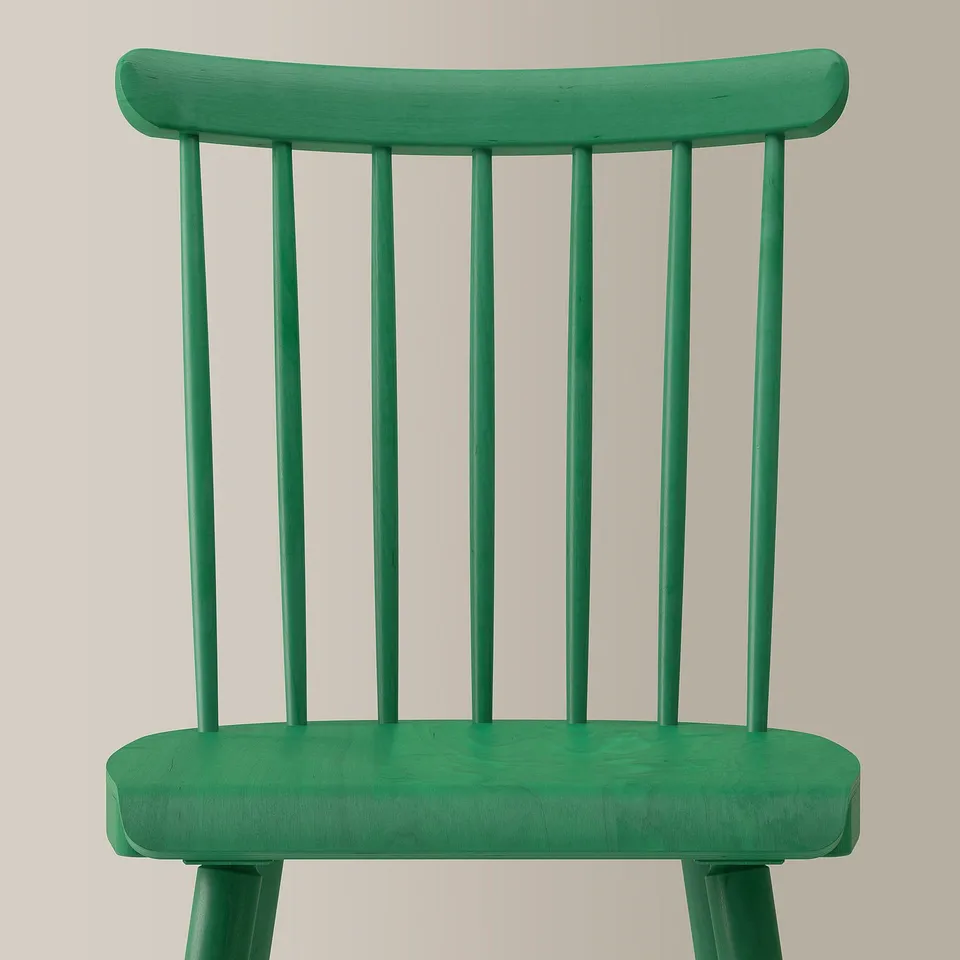 Bright green wooden chair with curved top, four slim spindles; clean, robust design.
