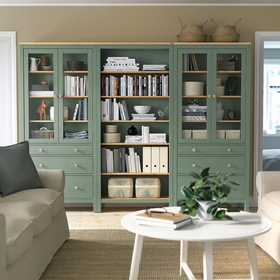 HEMNES storage unit with glass doors in living room.