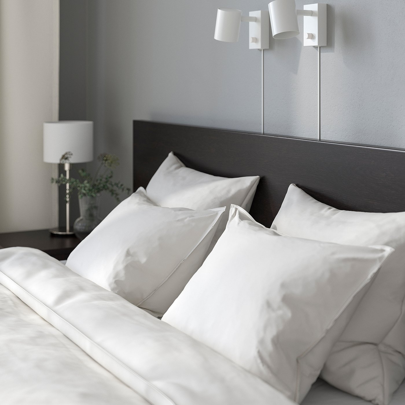 Clean modern bedroom with MALM bed, white sheets, and grey headboard. Wall lamps and a table lamp with plant beside the bed.