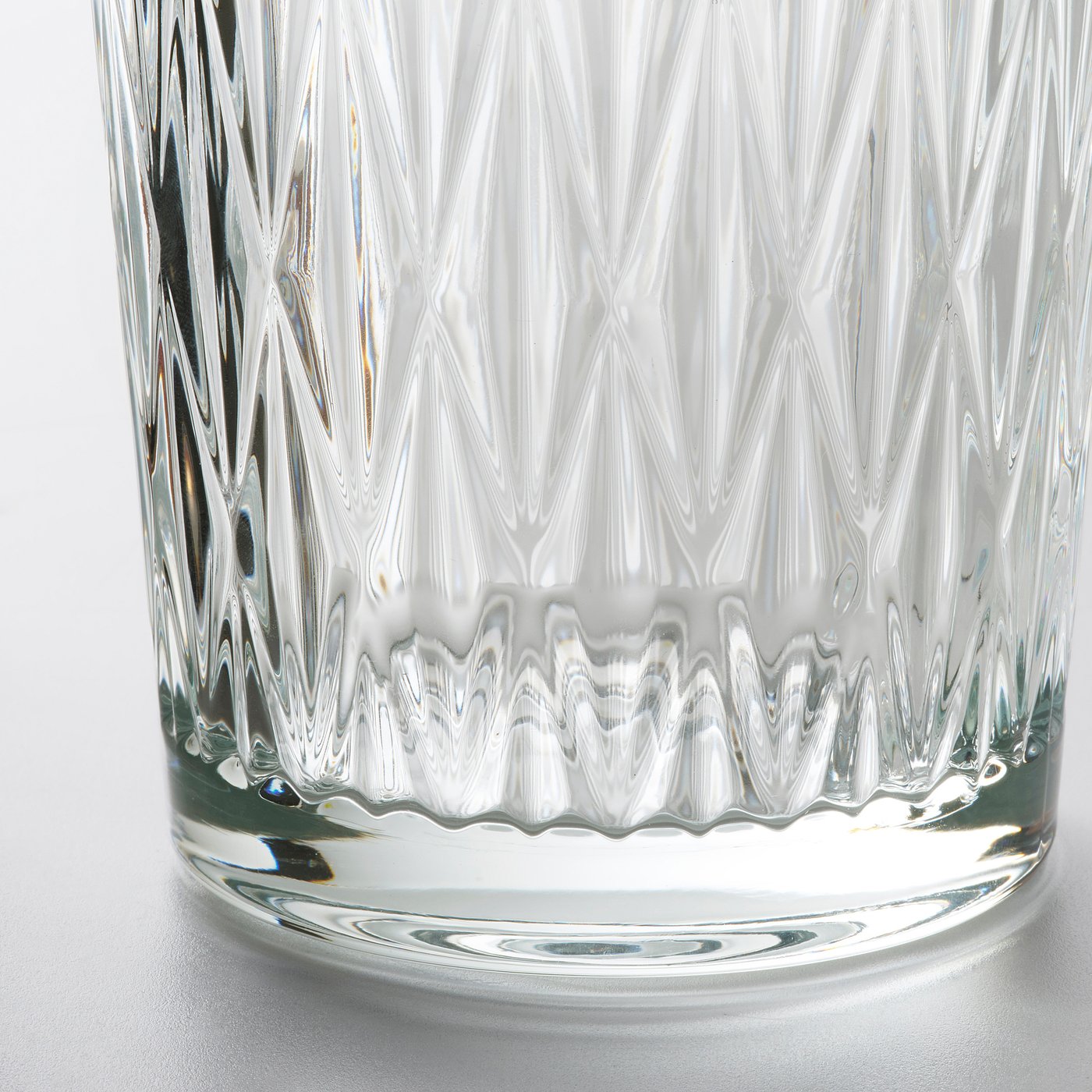 Clear glass vase with intricate, ridged design, showcasing high-quality craftsmanship and elegant, timeless style.