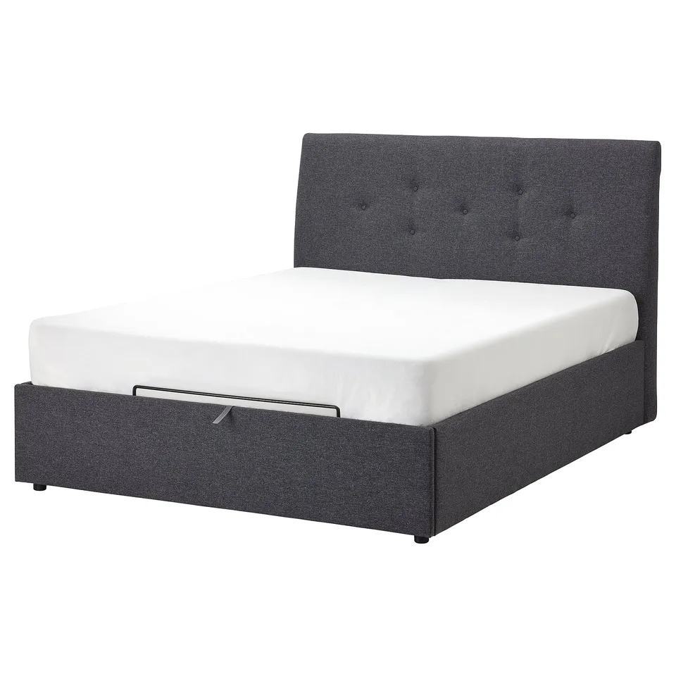 Idsane upholstered bed in grey with tufted headboard and underbed storage.