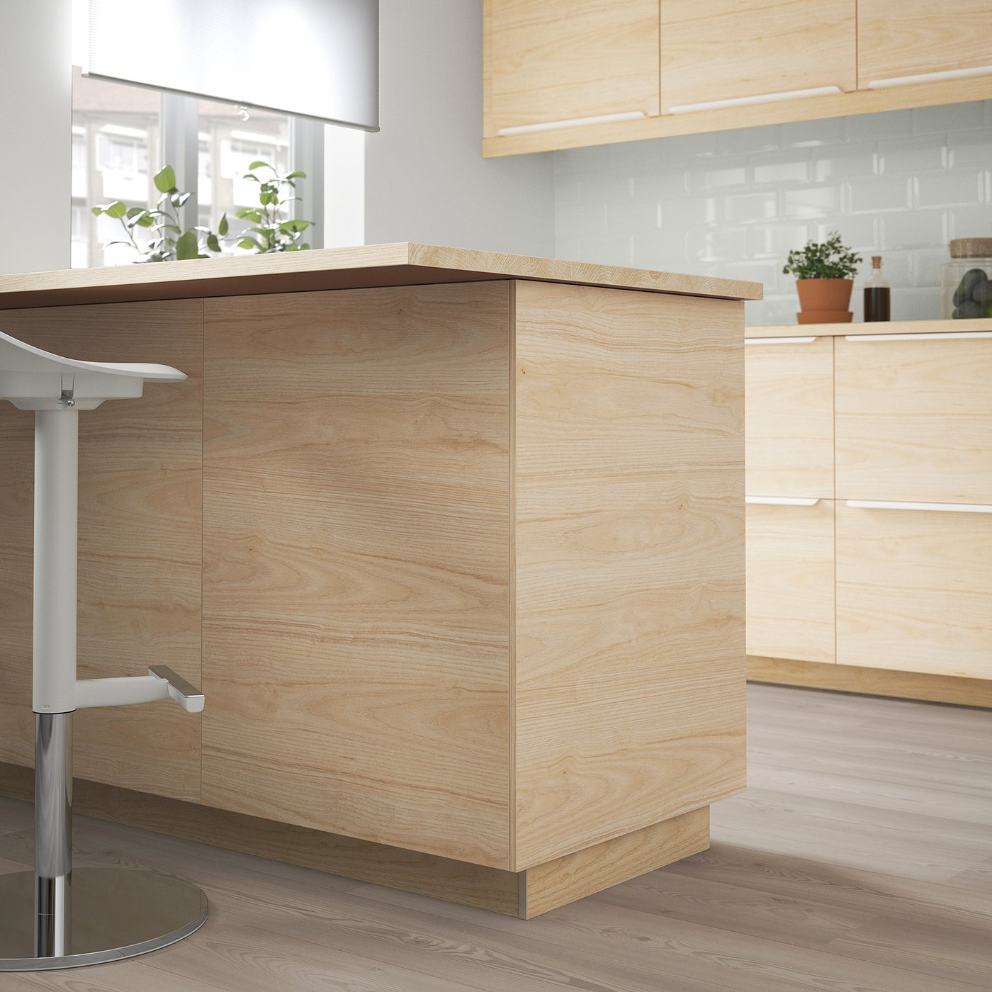 Light wooden kitchen island, ASKERSUND style, central in a modern kitchen with white and light wood tones, smooth and sleek design.