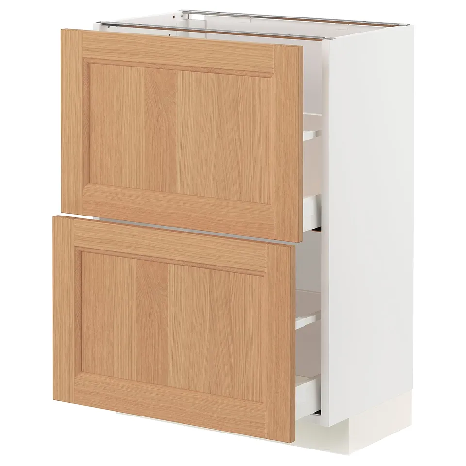 An open METOD kitchen cabinet with light oak doors and white interior.