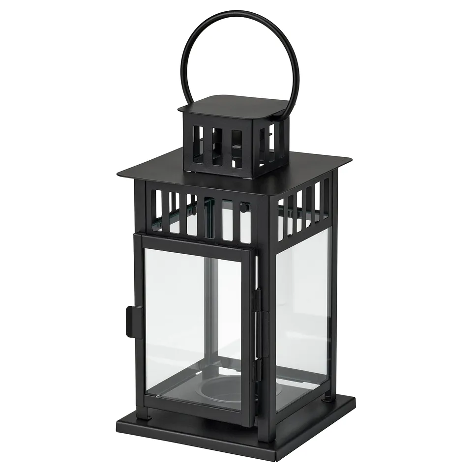 Black metal BORRBY lantern with glass panels, traditional shape, hanging loop, suitable for indoor/outdoor use.