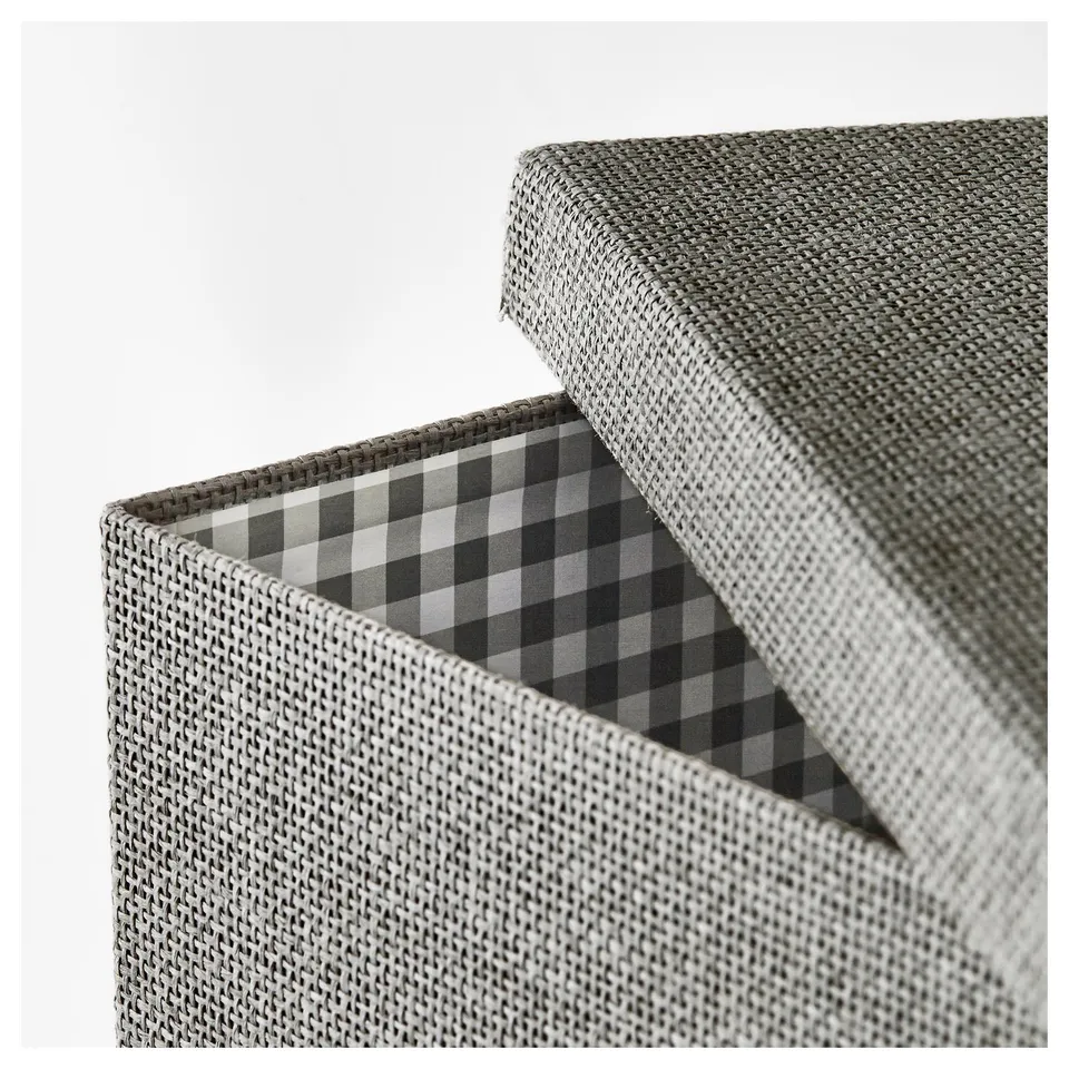 Open woven storage box with grey chequered lining.