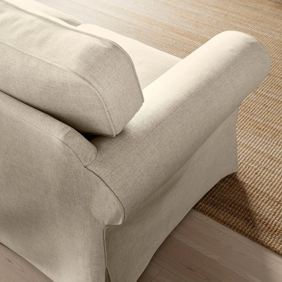 Comfortable EKTORP sofa with plush cushions, set on stylish wooden floor.