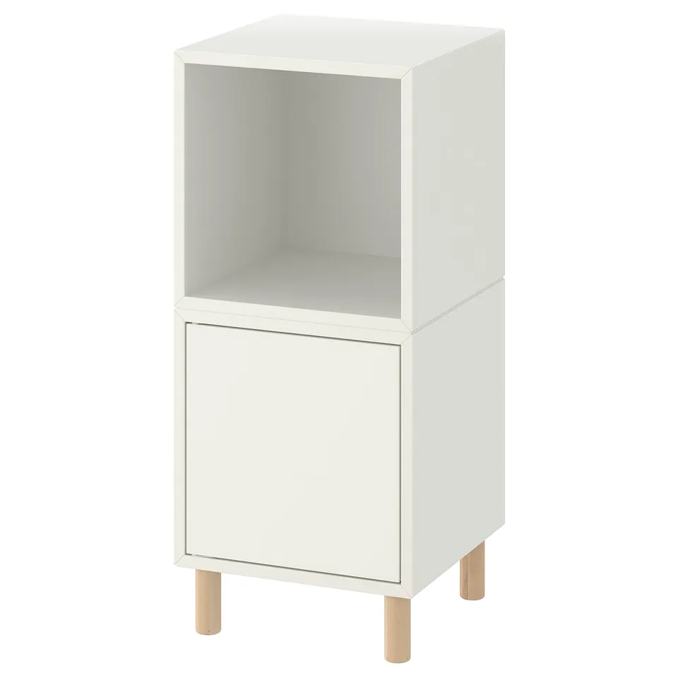 White EKET storage unit with wooden legs, open top, single drawer.
