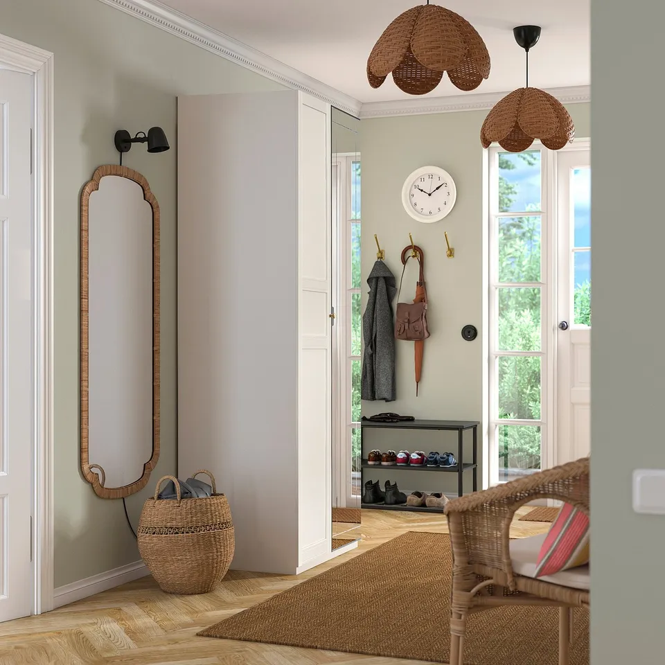 Entryway with pendant lamps, mirror, shoe rack, basket.