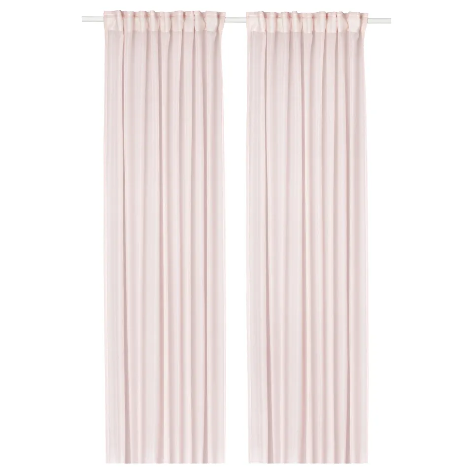 Two light pink sheer curtains hang side by side, softening light and adding a gentle, warm mood to a room.