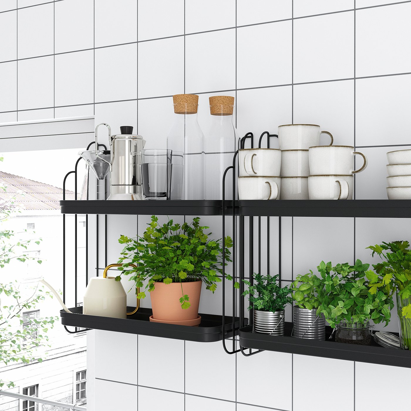 Modern wall shelf with black metal frame holds kitchenware, plants, and herbs. Displays mugs, jars, and greenery neatly.