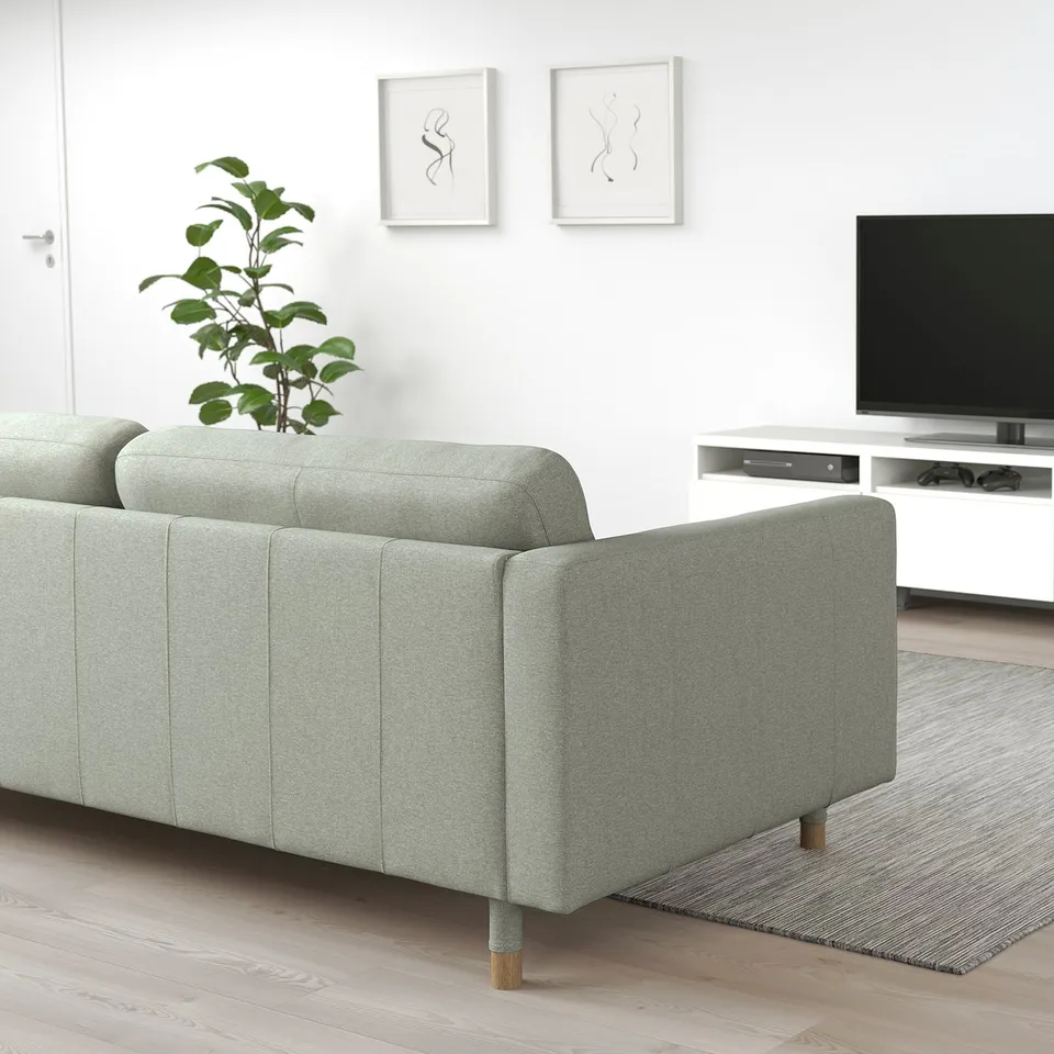 Grey LANDSKRONA sofa in modern living room with tv and plant.