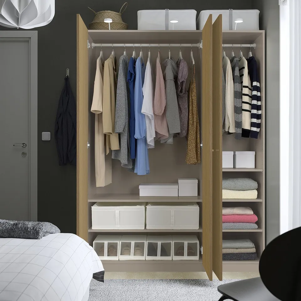 Wardrobe with clothes and bed; wooden, open