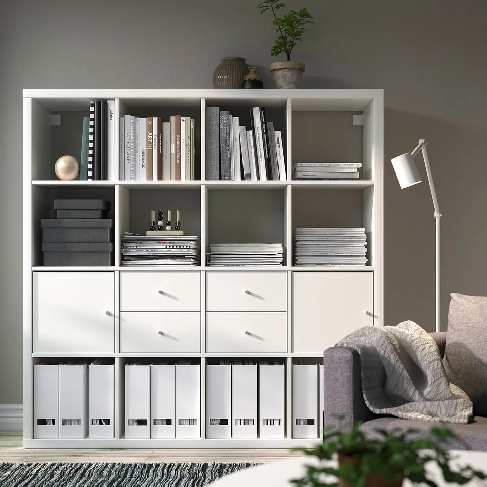 KALLAX bookshelf with books, magazines, and decor.