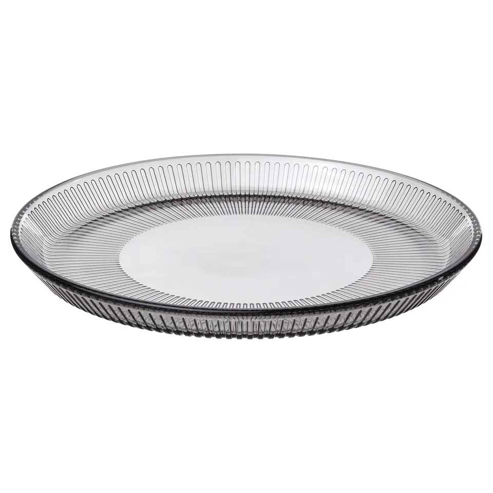 Round grey glass plate with vertical line design.