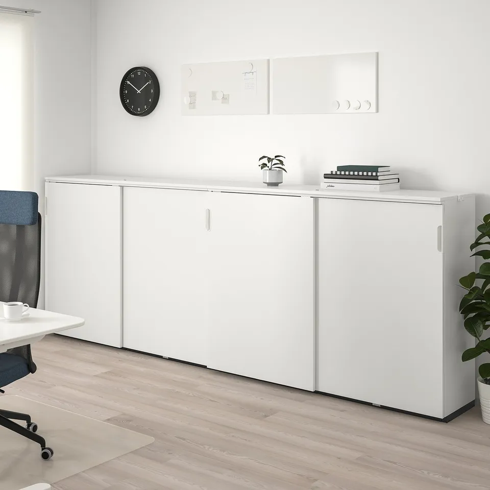 White GALANT office storage unit with sliding doors, ideal for supplies.