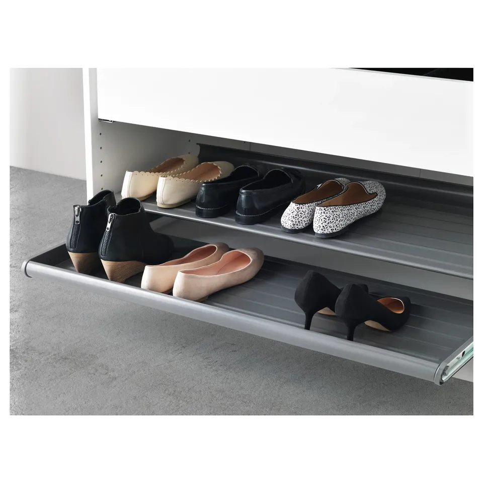 KOMPLEMENT metal shoe shelf with alternating levels.