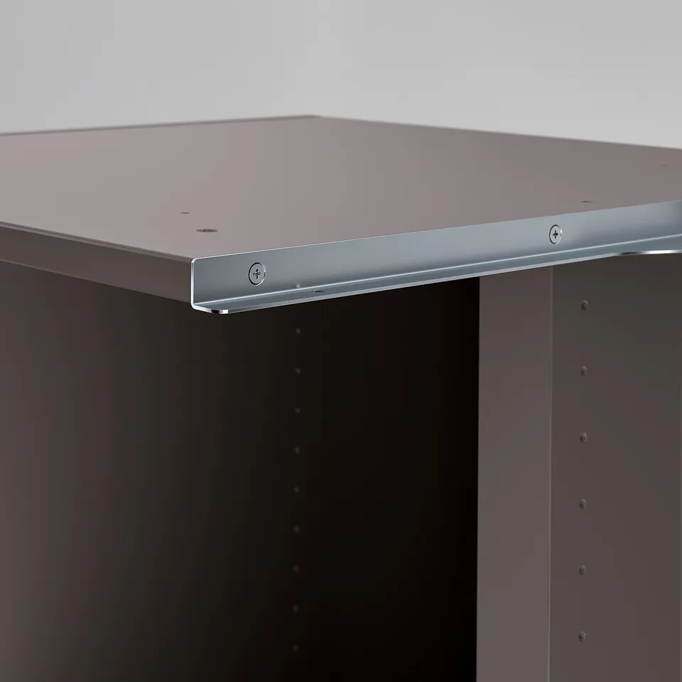Close-up of sleek, modern shelf unit with metallic trim, showing sturdy design and quality construction.