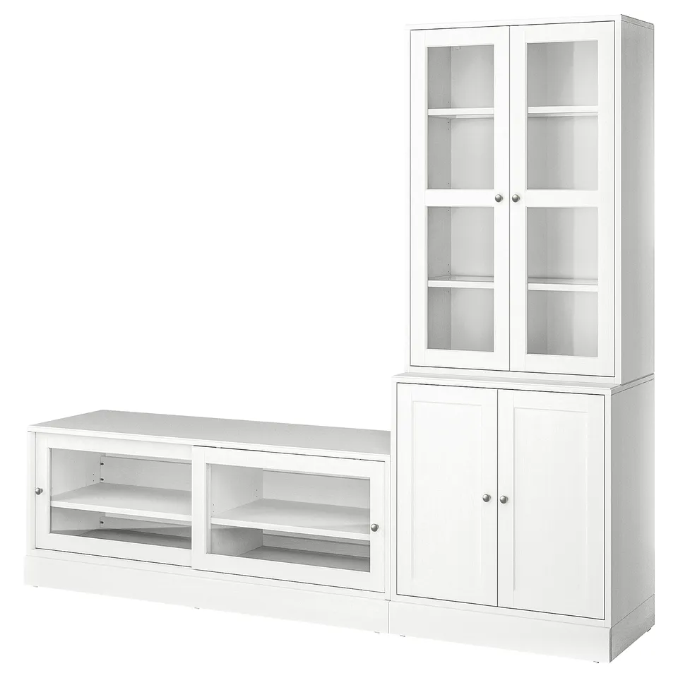 White HAVSTA furniture set: tall glass cabinet, wide open shelf, and lower cabinet. Solid pine with clear finish and glass doors.