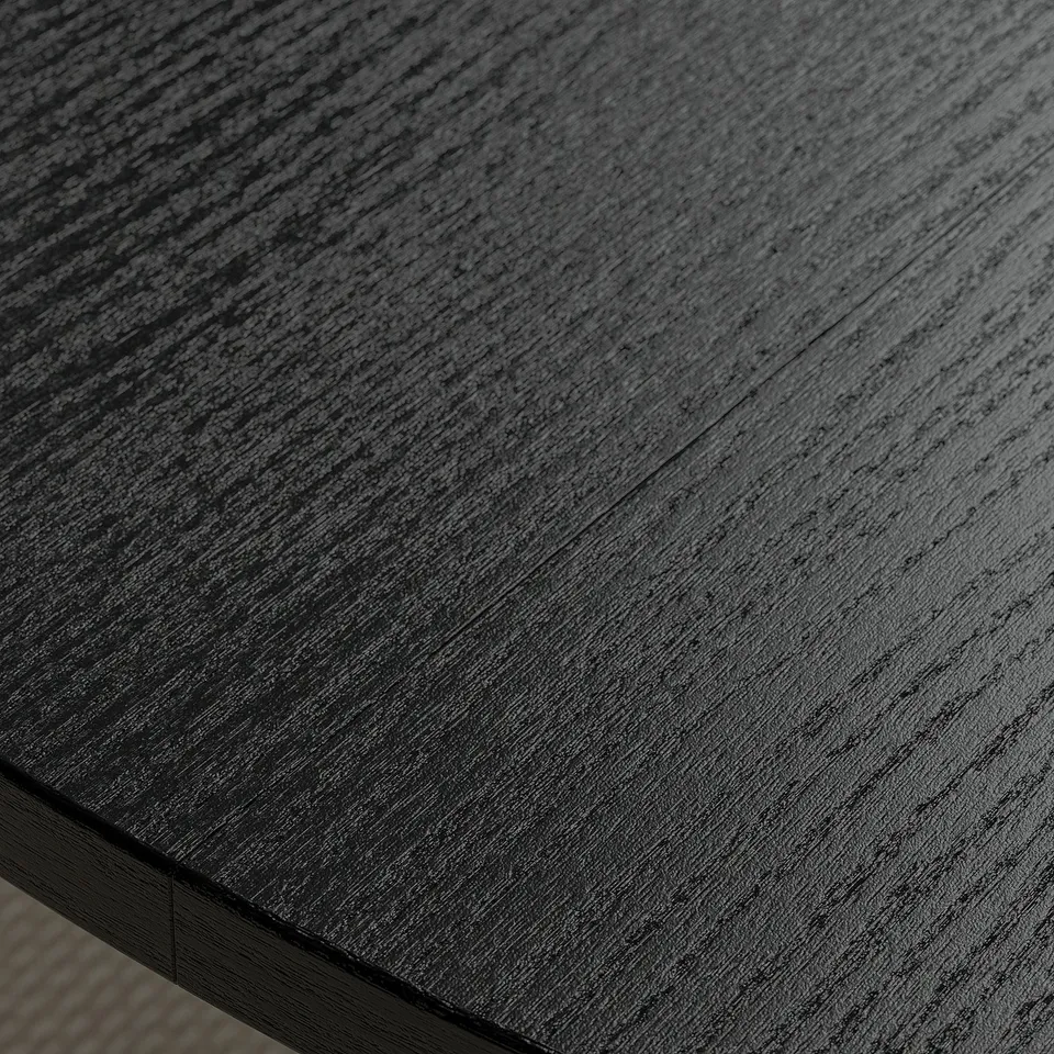 Sleek, black round tabletop with smooth finish, crafted for durability and modern design.