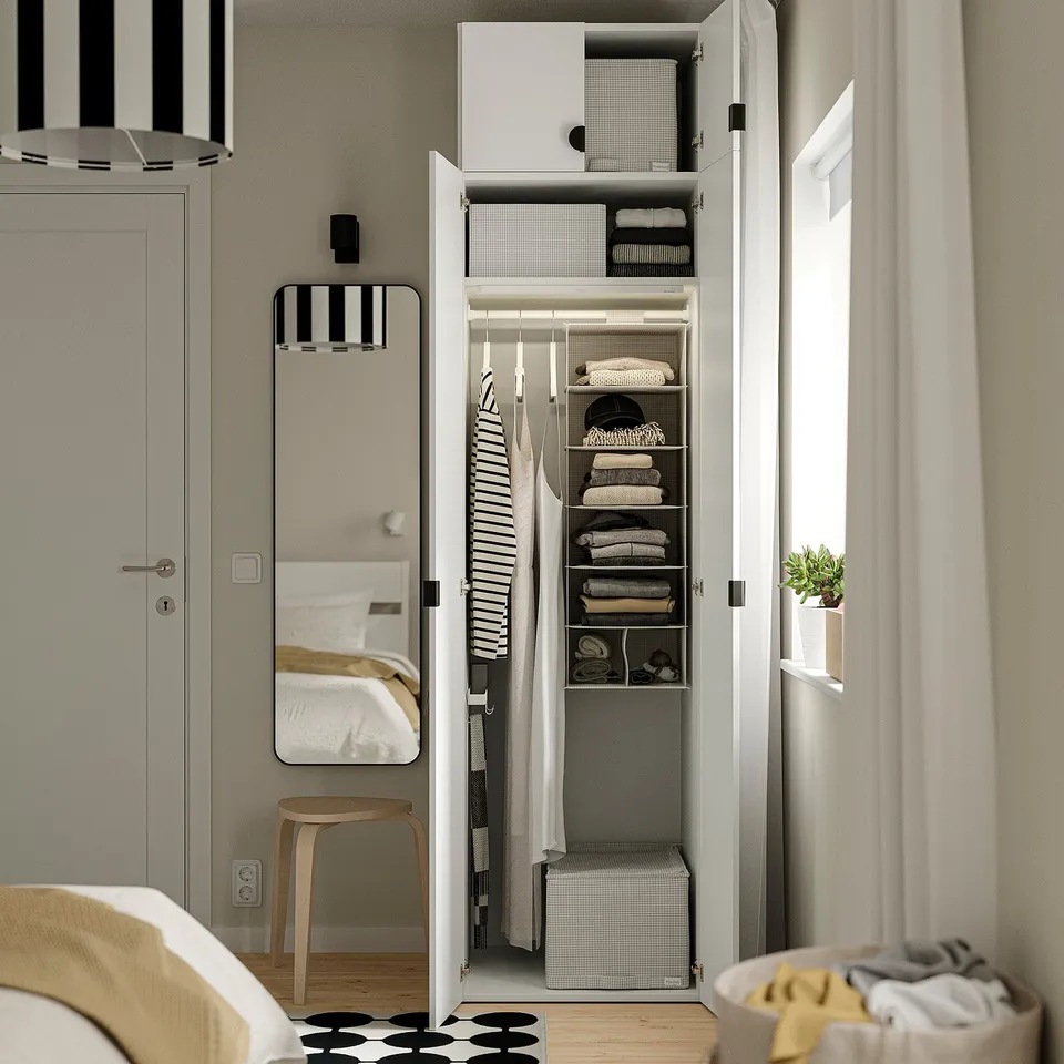 Organised wardrobe with led-lit shelves and hanging space.