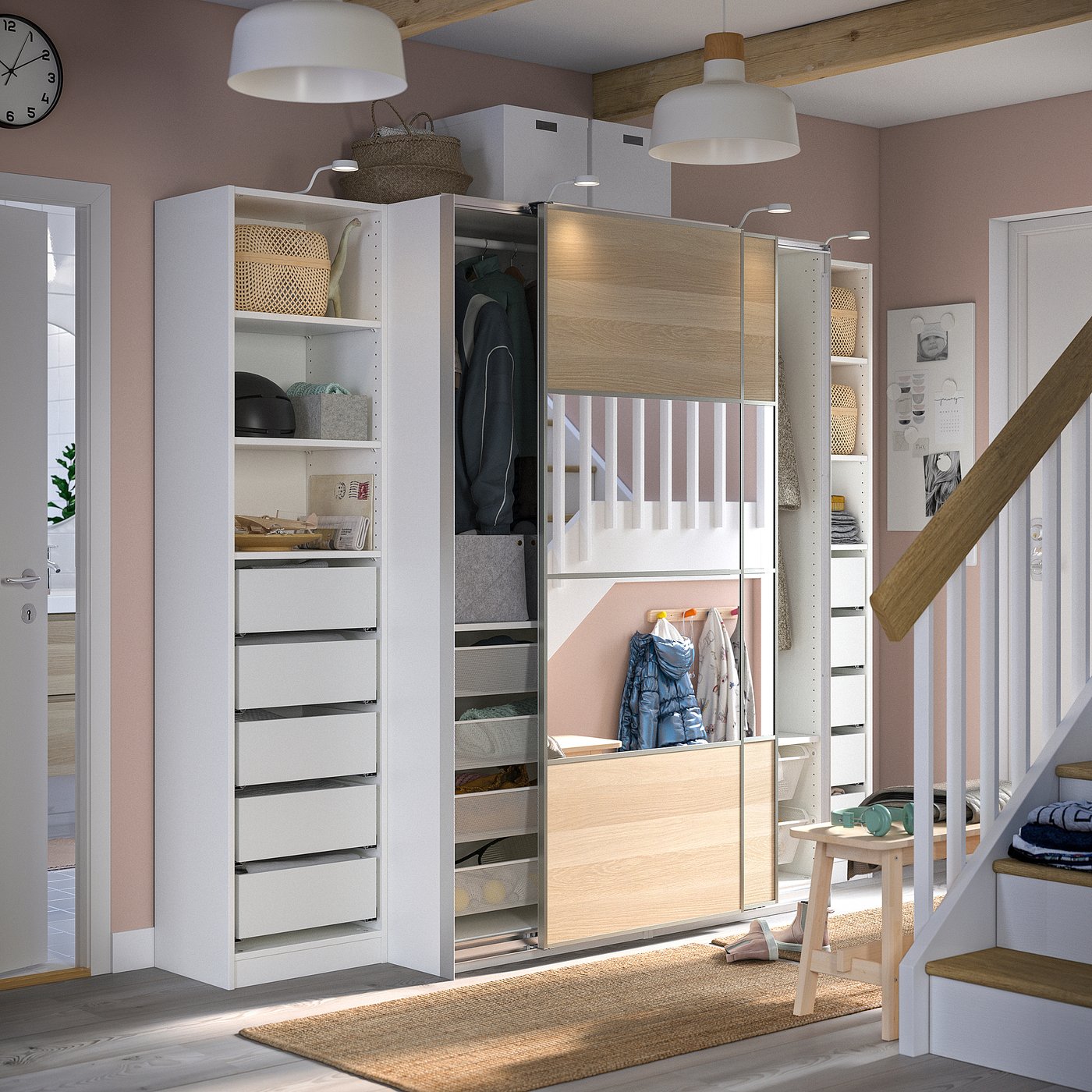 Modern white wardrobe with sliding doors, drawers, & storage. Wooden staircase, stylish home interior.