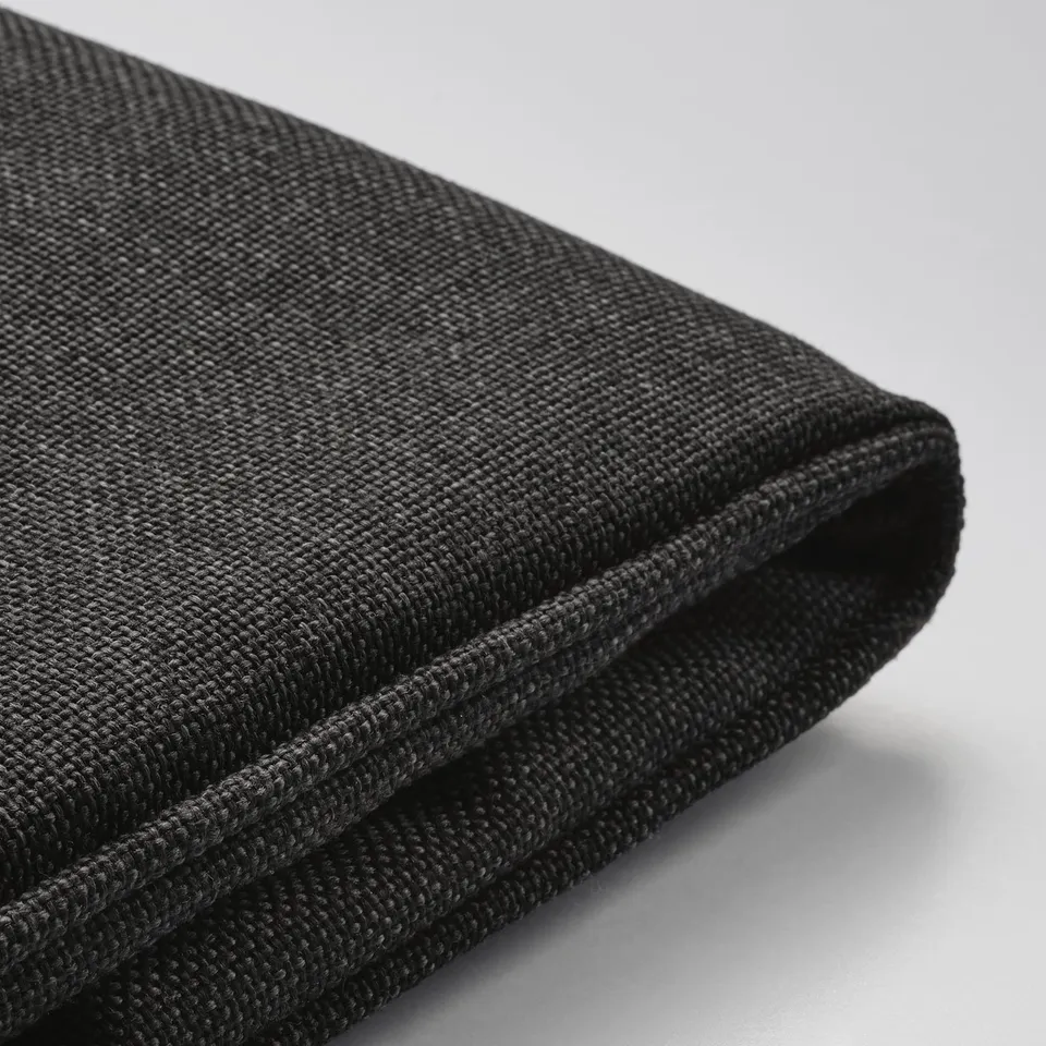 Close-up of durable, textured black cushion cover, showcasing its high-quality, fade-resistant material and water repellent finish.