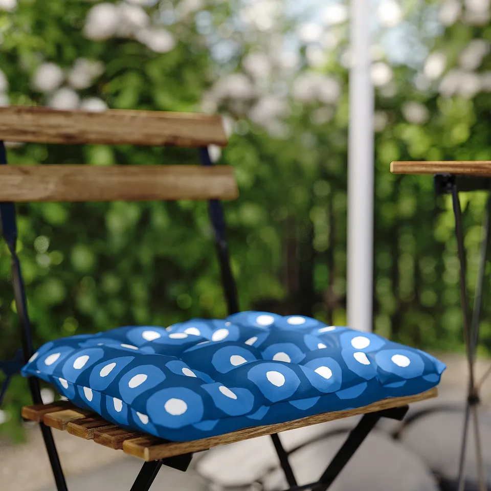 Blue patterned cushion on outdoor chair