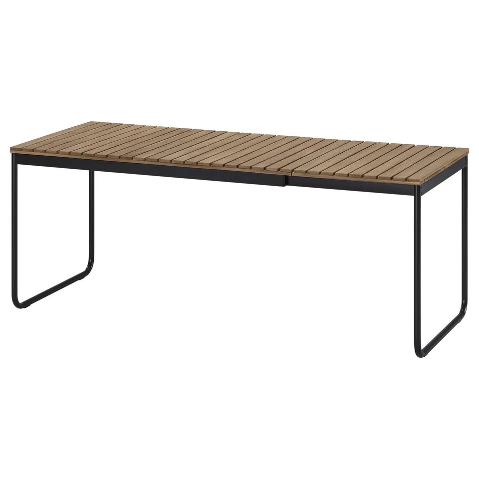 IKEA VÄSMAN outdoor dining table, black-brown, acacia wood top, rectangular.