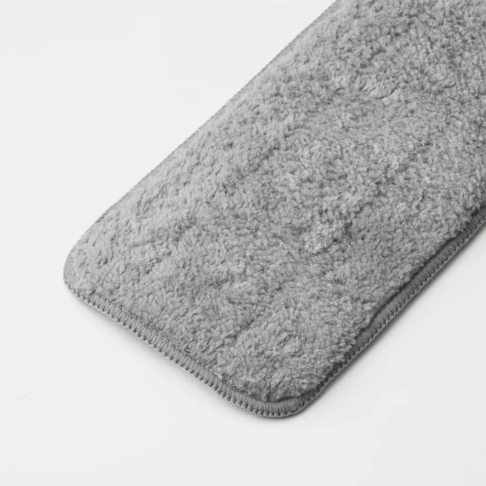 Folded grey microfiber cleaning pad. Soft, textured surface indicates quality and absorbency.