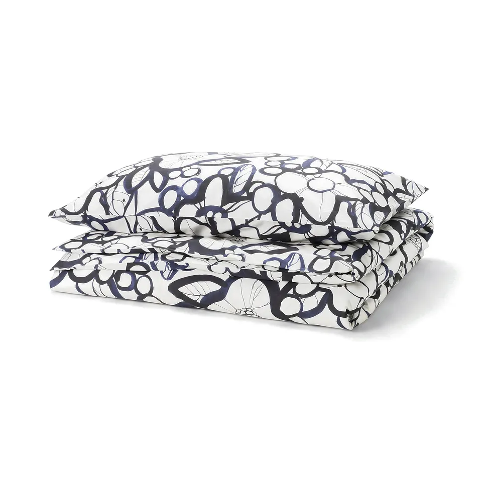 HÄRLIR duvet set, white & blue floral, cotton/lyocell, bold nature-inspired design.