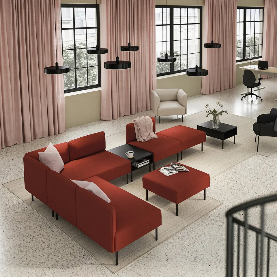 Modern living room with LILLEHEM orange sofa, red ottoman, black coffee tables, armchair, office desk, and pink curtains with black pendant lamps.